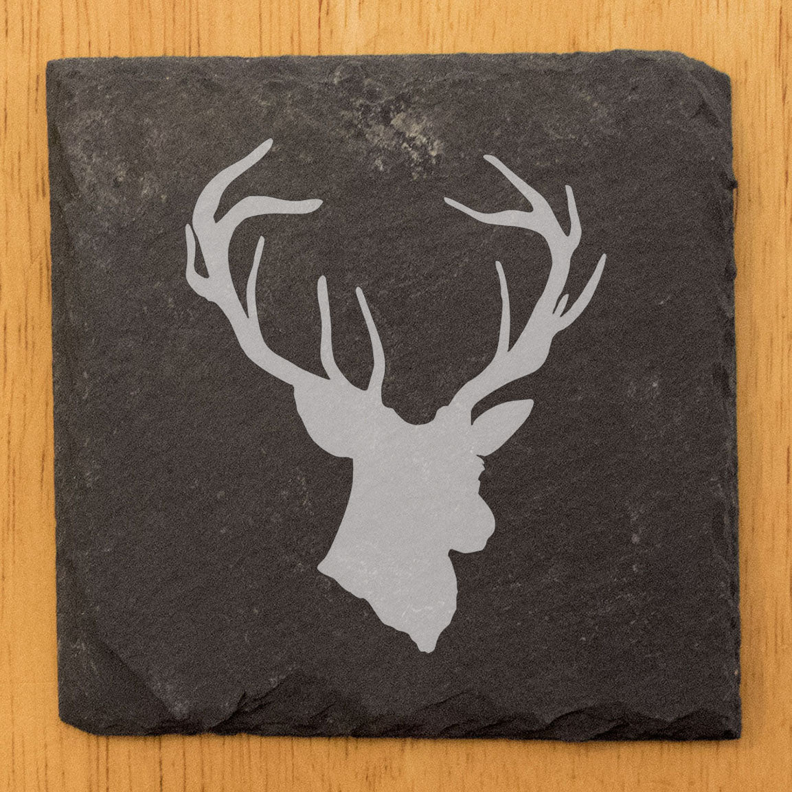 Rustic Charm: Natural Gray Slate Coasters with Striking Stag Antlers