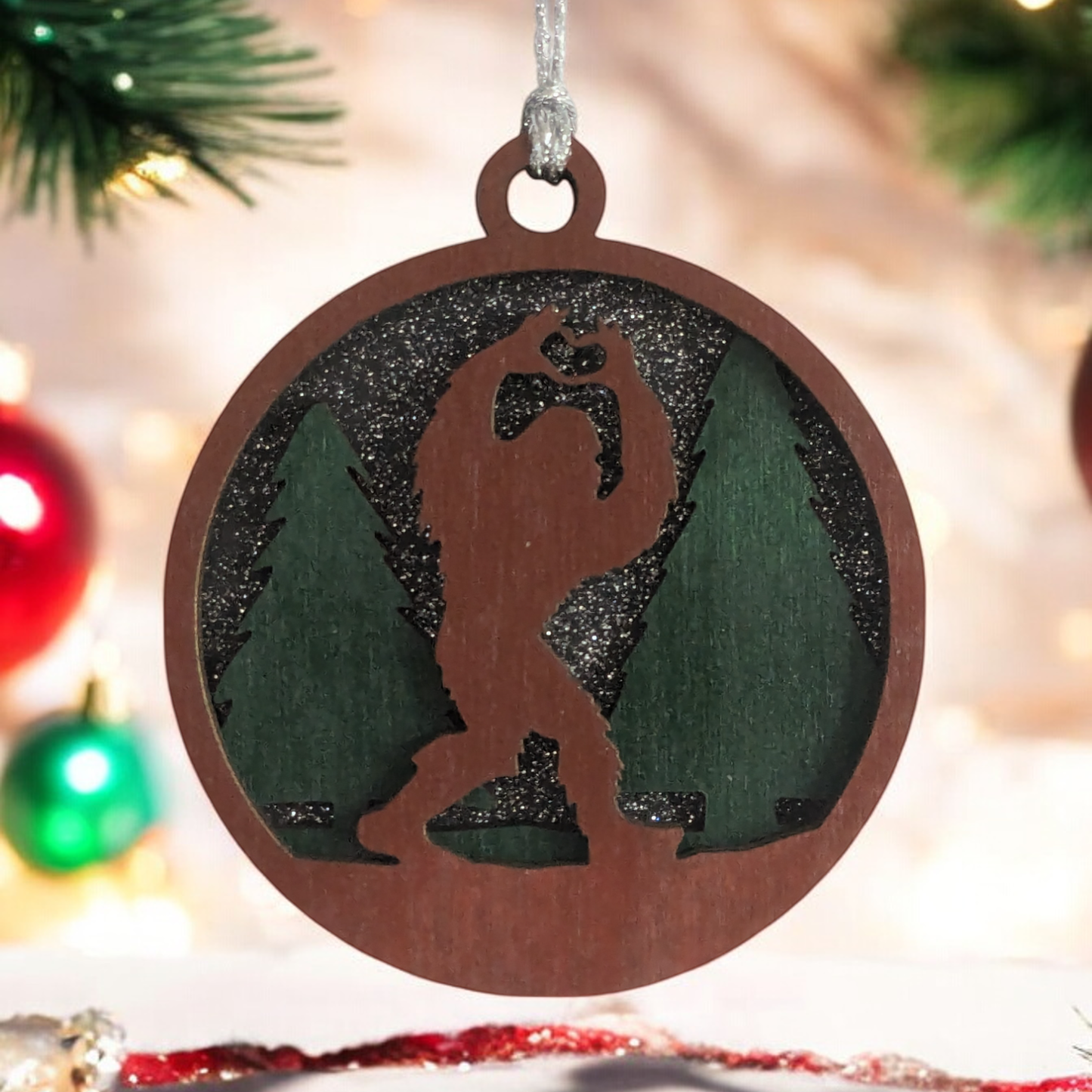 Bigfoot Heart Hands 3D Wood Christmas Ornament - Handcrafted Sasquatch Forest Scene, 3" Round Laser Cut