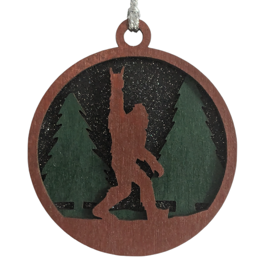 Unique 3" Wooden Bigfoot Ornament - 3-Layer Laser Cut, Sasquatch Throwing Rock Horns, Glitter Night Sky, Oregon-Made