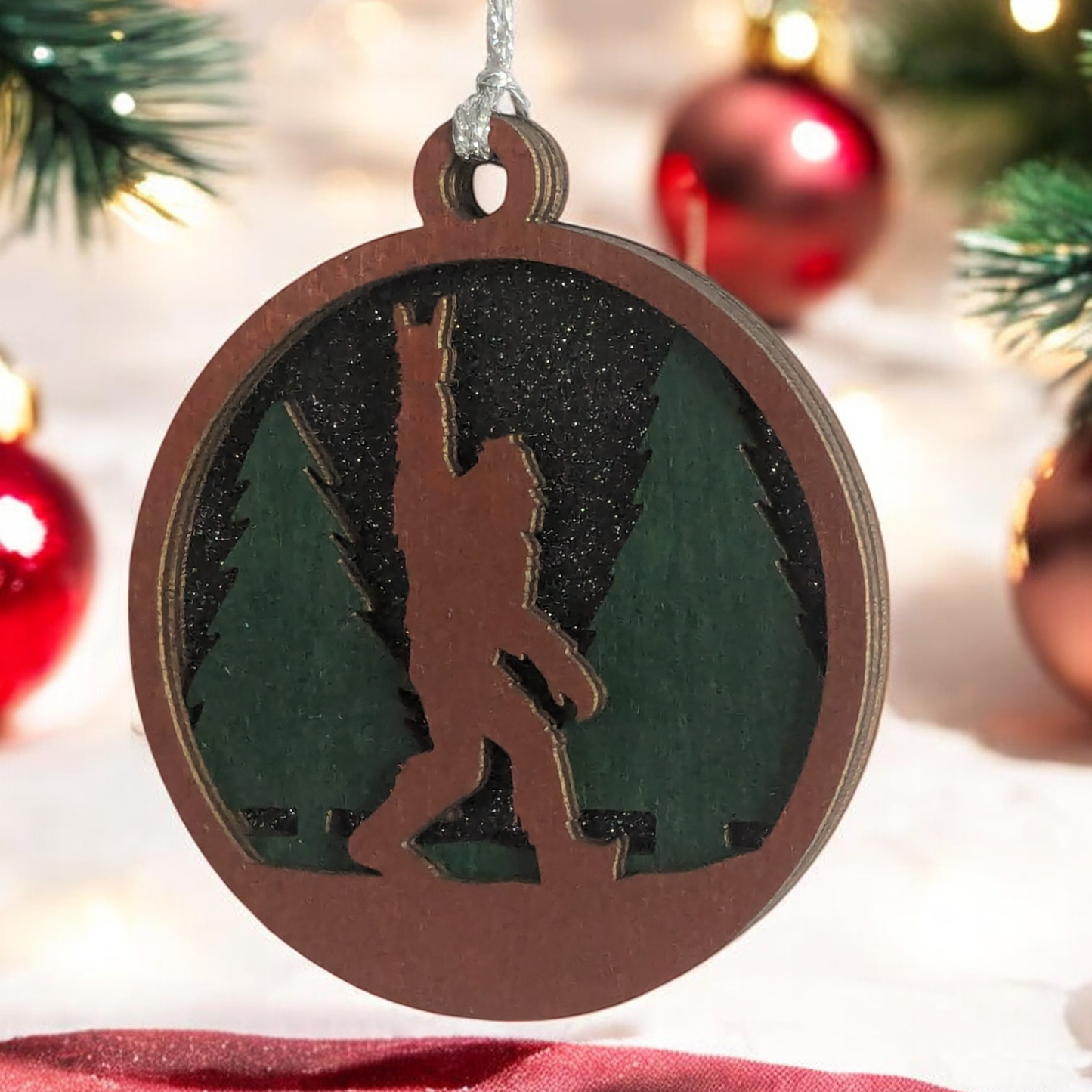 Unique 3" Wooden Bigfoot Ornament - 3-Layer Laser Cut, Sasquatch Throwing Rock Horns, Glitter Night Sky, Oregon-Made