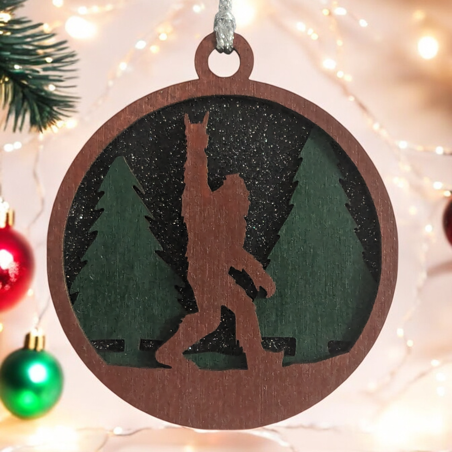 Unique 3" Wooden Bigfoot Ornament - 3-Layer Laser Cut, Sasquatch Throwing Rock Horns, Glitter Night Sky, Oregon-Made