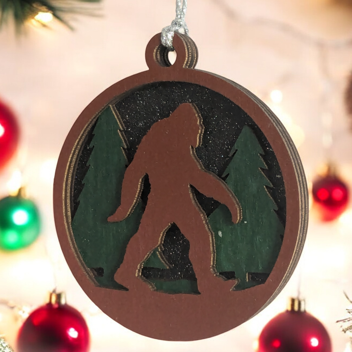 3-Layer Wooden Bigfoot Ornament - 3" Round Christmas Tree Decoration - Laser Cut Sasquatch Forest Scene - Oregon Handcrafted