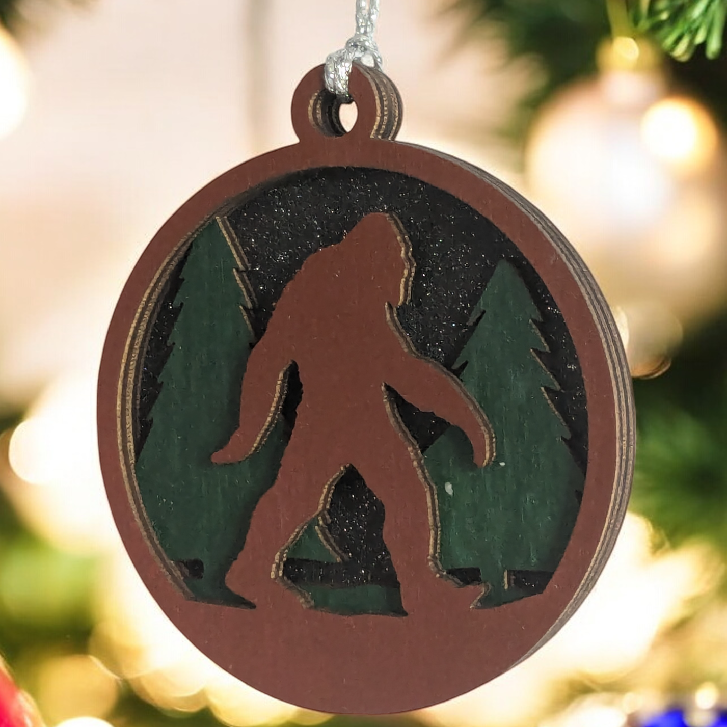 3-Layer Wooden Bigfoot Ornament - 3" Round Christmas Tree Decoration - Laser Cut Sasquatch Forest Scene - Oregon Handcrafted