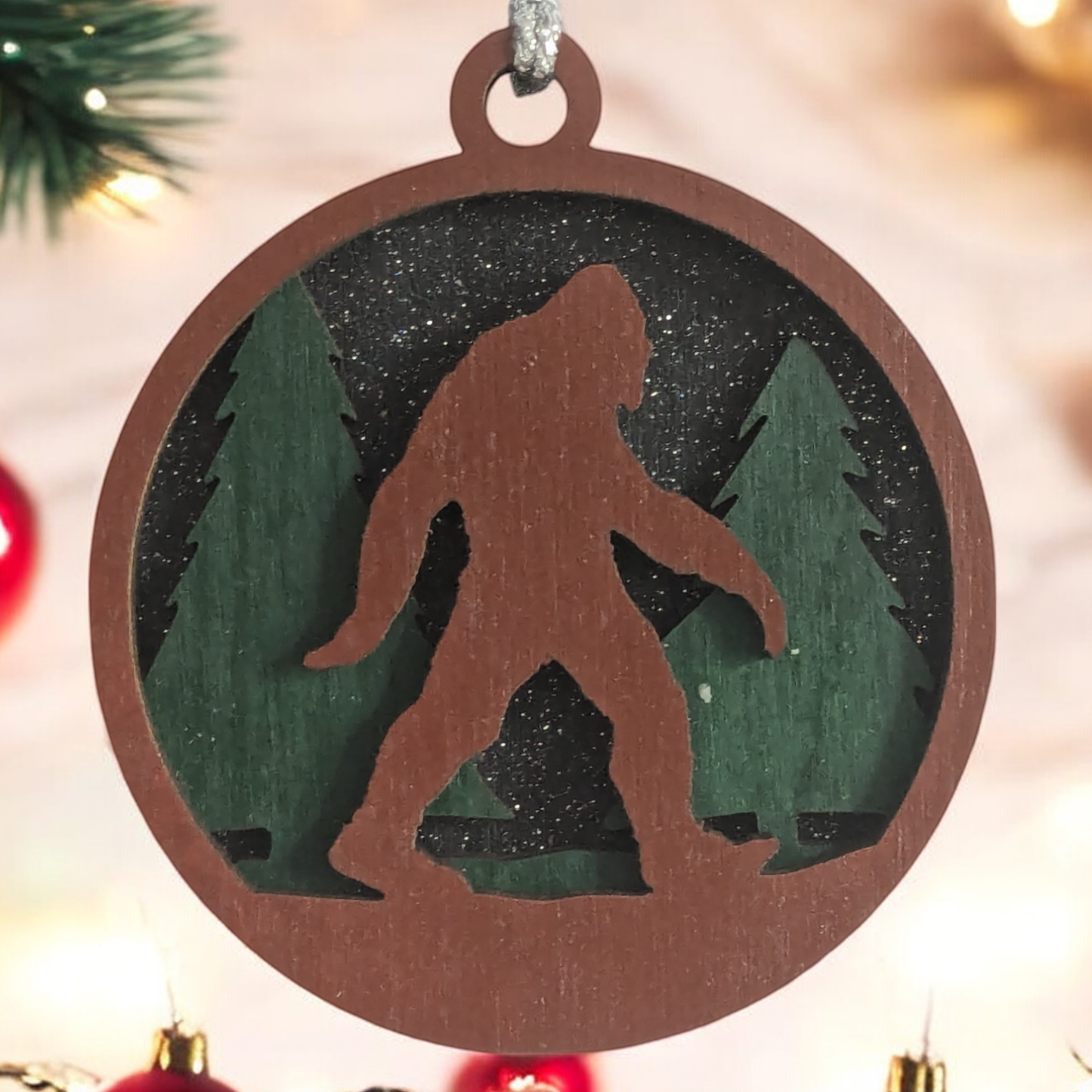 3-Layer Wooden Bigfoot Ornament - 3" Round Christmas Tree Decoration - Laser Cut Sasquatch Forest Scene - Oregon Handcrafted