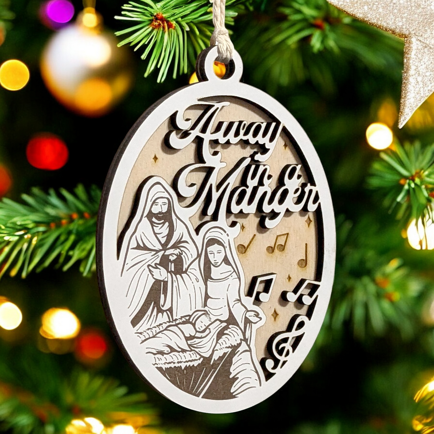 "Away In A Manger" 3.5"-5" Oval Laser Cut Wooden Christmas Ornament, Handcrafted in USA, Manger Scene with Joseph, Mary & Baby Jesus,  Phrase & Music Notes