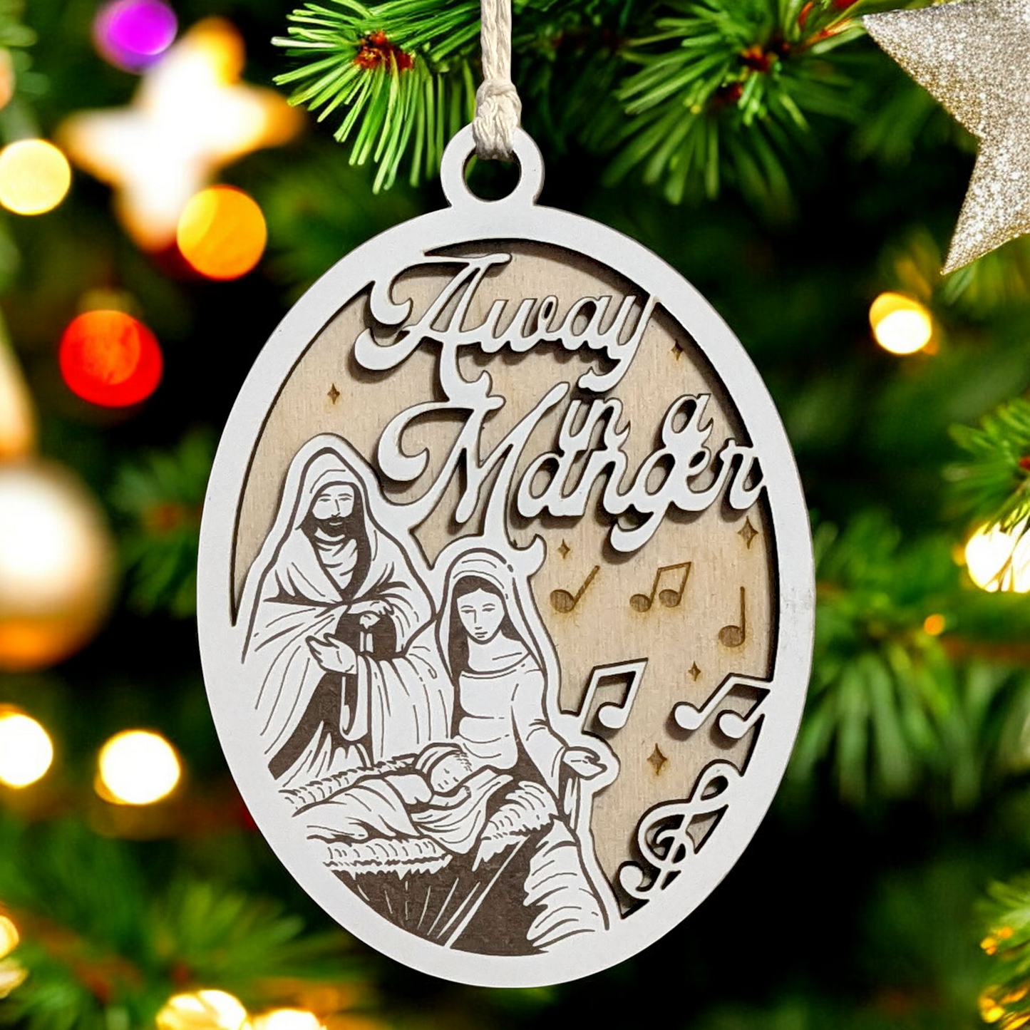 "Away In A Manger" 3.5"-5" Oval Laser Cut Wooden Christmas Ornament, Handcrafted in USA, Manger Scene with Joseph, Mary & Baby Jesus,  Phrase & Music Notes