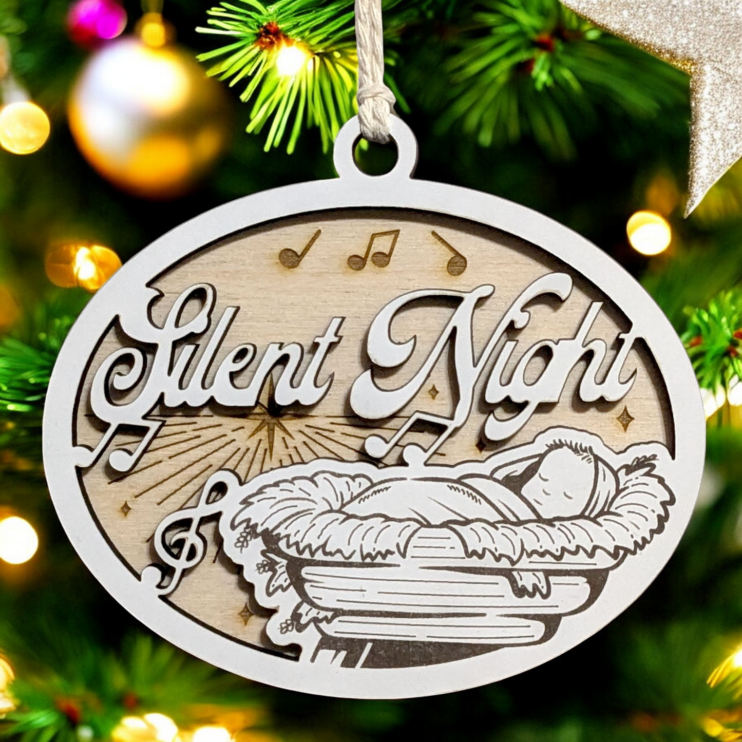 "Silent Night" 3.5"-5" Oval Laser Cut Wooden Christmas Ornament, Handcrafted in USA, Manger Scene with Baby Jesus & Music Notes, Whiteboard & Natural Wood Layers