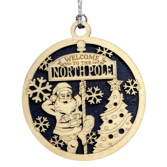 3" Round Two Layer Laser Cut Ornament - Funny Santa in Boxers Dancing Pole Near Tree with Snowflakes, 'Welcome to the North Pole' Sarcastic Humor - Handmade USA Wood Holiday Gag Gift Decor